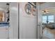 Hallway with beadboard wainscoting and access to other rooms at 5220 Brittany S Dr # 201, St Petersburg, FL 33715