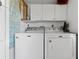 Laundry room with side-by-side washer and dryer at 541 Walden Ct, Dunedin, FL 34698