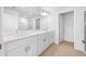 Bright bathroom featuring double sinks, a large mirror, and modern fixtures at 5913 Laurelcrest Gln, Palmetto, FL 34221