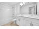 Clean bathroom with double vanity, large mirror, and a bathtub at 5913 Laurelcrest Gln, Palmetto, FL 34221