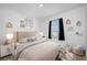 Lovely bedroom with a blush pink bed, stylish decor, and soft lighting at 5913 Laurelcrest Gln, Palmetto, FL 34221