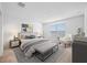 Spacious bedroom with large bed, plush seating, and ample natural light at 5913 Laurelcrest Gln, Palmetto, FL 34221
