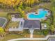 Community pool with lounge chairs and a clubhouse at 5913 Laurelcrest Gln, Palmetto, FL 34221
