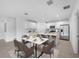 Kitchen with island and dining area with six chairs at 5913 Laurelcrest Gln, Palmetto, FL 34221