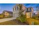 Two-story house with gray siding, two-car garage, and landscaping at 5913 Laurelcrest Gln, Palmetto, FL 34221