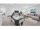 Game room with air hockey table and comfortable seating at 5913 Laurelcrest Gln, Palmetto, FL 34221