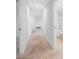 Clean hallway with light walls and neutral carpet at 5913 Laurelcrest Gln, Palmetto, FL 34221