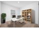 Home office with a desk, shelving, and a large window at 5913 Laurelcrest Gln, Palmetto, FL 34221