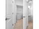 Bright laundry room with washer, dryer, and ample shelf space at 5913 Laurelcrest Gln, Palmetto, FL 34221
