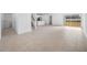 Open concept living room with tile flooring and view of backyard at 5913 Laurelcrest Gln, Palmetto, FL 34221