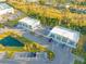 Aerial view of a shopping center with stores and parking at 5913 Laurelcrest Gln, Palmetto, FL 34221