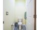 Small half bathroom with toilet and gray tile floor at 5914 Fiore Dr, Bradenton, FL 34208