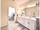 Double vanity bathroom with view into bedroom at 5914 Fiore Dr, Bradenton, FL 34208