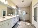 Bathroom with double vanity, large shower, and tile floor at 5914 Fiore Dr, Bradenton, FL 34208