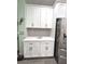 White kitchen cabinets and countertops with gray backsplash at 5914 Fiore Dr, Bradenton, FL 34208