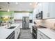 White kitchen with stainless steel appliances at 5914 Fiore Dr, Bradenton, FL 34208