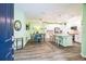 Open concept kitchen with white cabinets and island at 5914 Fiore Dr, Bradenton, FL 34208