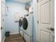 Bright laundry room with washer, dryer, and ample storage at 5914 Fiore Dr, Bradenton, FL 34208
