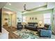 Living room with gray leather couches and rug at 5914 Fiore Dr, Bradenton, FL 34208