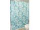 Bathroom with a teal shower curtain and nautical theme at 6033 34Th W St # 45, Bradenton, FL 34210