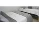 Guest bedroom with two twin-size beds at 6033 34Th W St # 45, Bradenton, FL 34210