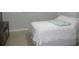 Bedroom with white bedding and a media console at 6033 34Th W St # 45, Bradenton, FL 34210