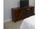 Bedroom with a media console and tiled floor at 6033 34Th W St # 45, Bradenton, FL 34210