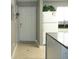 Clean entryway with tiled floor and a view into the kitchen at 6033 34Th W St # 45, Bradenton, FL 34210