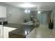 Open concept kitchen with breakfast bar, looking into the living room at 6033 34Th W St # 45, Bradenton, FL 34210