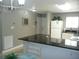 Open concept kitchen with breakfast bar, looking into the living room at 6033 34Th W St # 45, Bradenton, FL 34210