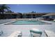 Community pool with lounge chairs at 6033 34Th W St # 45, Bradenton, FL 34210