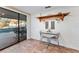 Kitchen nook with pool view, table for two, and whitewashed brick at 6237 Spring Hill Dr, Spring Hill, FL 34606