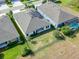 Aerial view showcasing a home's backyard, solar panels, and surrounding houses at 6442 Maiden Sea Dr, Apollo Beach, FL 33572