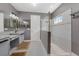 Elegant bathroom featuring double sinks and a large walk-in shower at 6442 Maiden Sea Dr, Apollo Beach, FL 33572