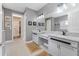 Double vanity bathroom with granite countertops and walk-in shower at 6442 Maiden Sea Dr, Apollo Beach, FL 33572