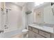 Clean bathroom with a shower/tub combo and granite countertop at 6442 Maiden Sea Dr, Apollo Beach, FL 33572