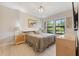 Bright bedroom with light wood flooring and large windows at 6442 Maiden Sea Dr, Apollo Beach, FL 33572