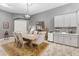 Elegant dining room features a wood table and built-in coffee bar at 6442 Maiden Sea Dr, Apollo Beach, FL 33572
