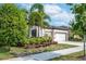 Two-story house with two-car garage and manicured landscaping at 6442 Maiden Sea Dr, Apollo Beach, FL 33572
