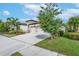 Two-story house with two-car garage and lush landscaping at 6442 Maiden Sea Dr, Apollo Beach, FL 33572