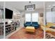 Home office with built-in shelving and comfortable seating at 6442 Maiden Sea Dr, Apollo Beach, FL 33572