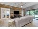 Bright living room with sectional sofa and large sliding glass doors at 6442 Maiden Sea Dr, Apollo Beach, FL 33572