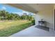 Covered patio overlooking backyard and landscape at 6442 Maiden Sea Dr, Apollo Beach, FL 33572