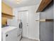 Laundry room with washer, dryer, and built-in shelving at 7132 111Th St, Seminole, FL 33772