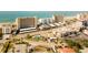 Aerial view of community near beach, featuring multiple buildings and a pool at 744 Cadiz Rd # 1, Venice, FL 34285