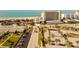 Aerial view of beachfront property, showing ocean, building, and parking at 744 Cadiz Rd # 1, Venice, FL 34285