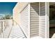 Private balcony with white railings, offering an outdoor space at 744 Cadiz Rd # 1, Venice, FL 34285