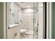 Small bathroom with a walk-in shower and granite countertop at 744 Cadiz Rd # 1, Venice, FL 34285