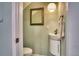 Small half bathroom with a pedestal sink and mirror at 744 Cadiz Rd # 1, Venice, FL 34285