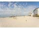 Beachfront view with volleyball court and ocean at 744 Cadiz Rd # 1, Venice, FL 34285